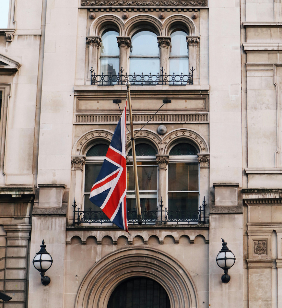 Flag Hanging Beside a Building
